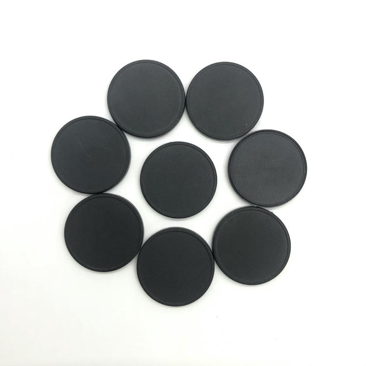 Hvidt ABS RFID disktag egnet til lasergravering af numre eller logoer.